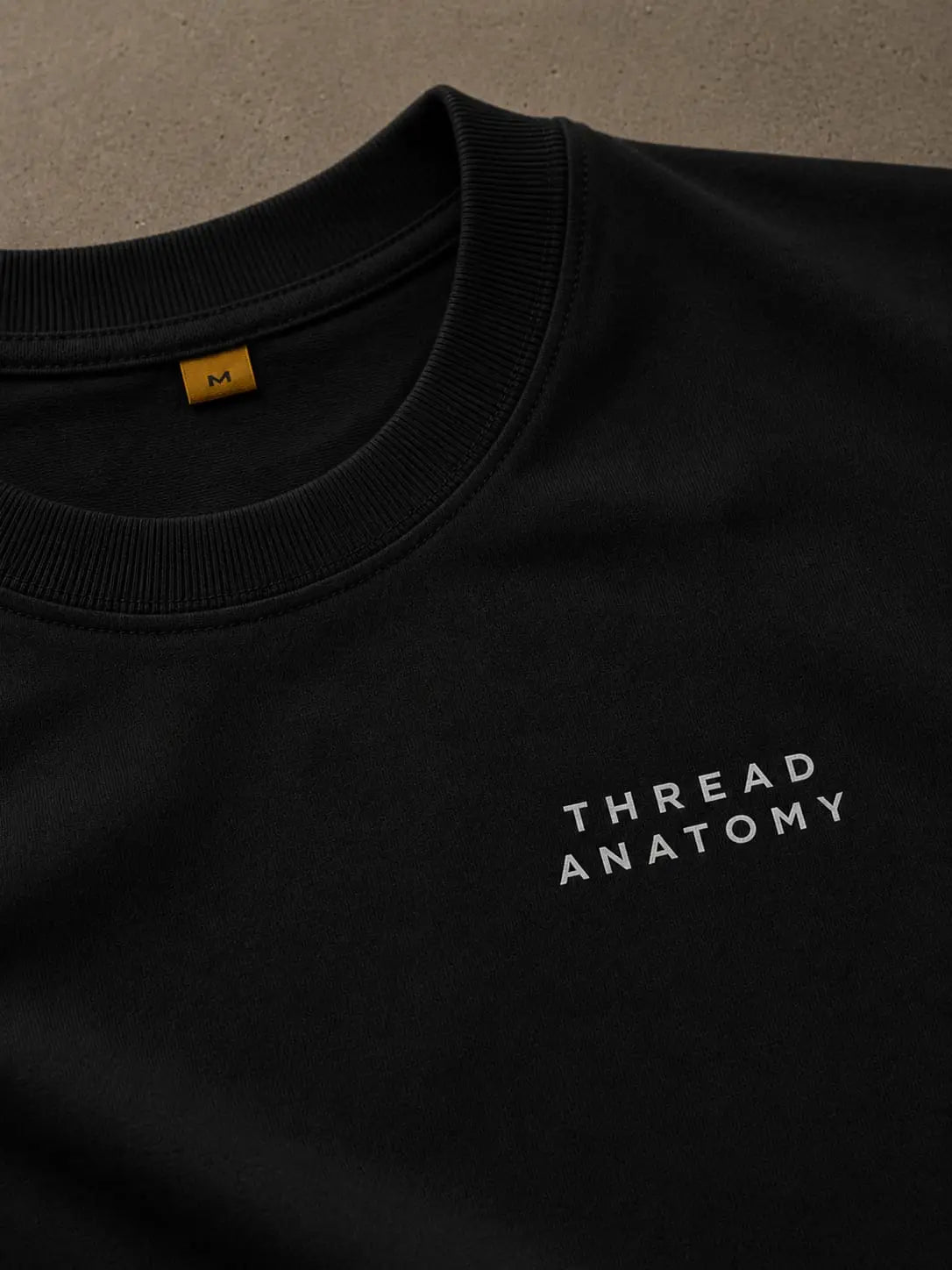 Thread Anatomy logo embroidery on premium black cotton oversized T-shirt