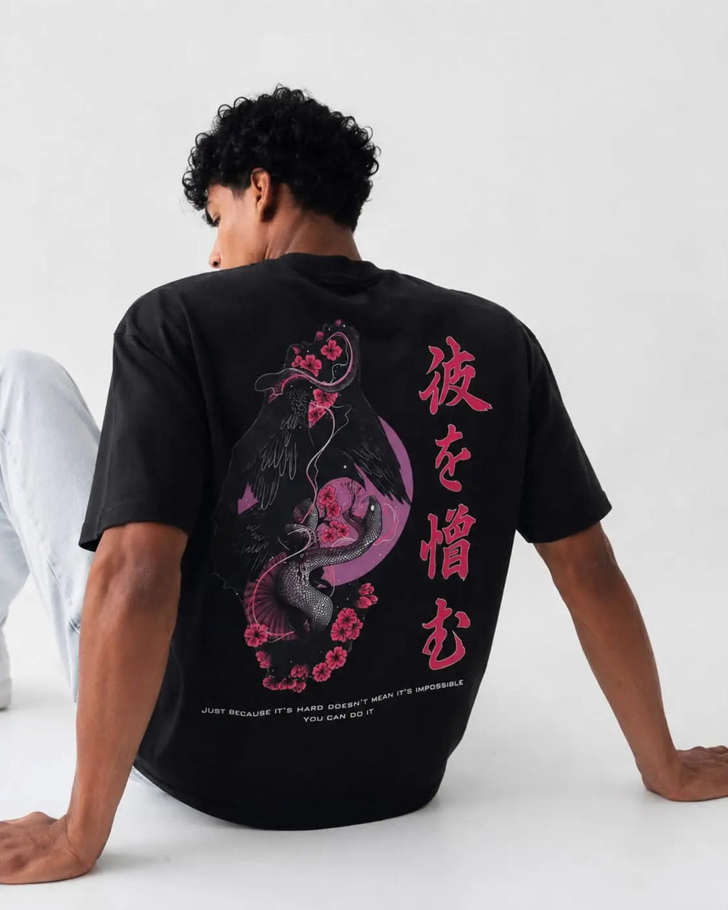 Back design of Sakura Raven Oversized T-Shirt with pink sakura and raven streetwear artwork