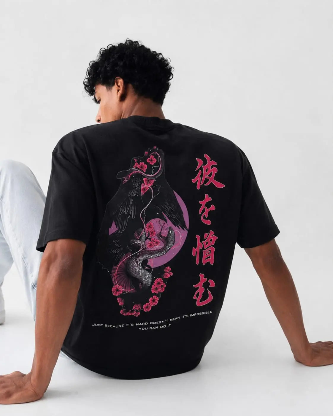 Back design of Sakura Raven Oversized T-Shirt with pink sakura and raven streetwear artwork